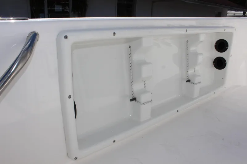 Slide: The Image of 2022 NauticStar 195 XTS boat storage compartment with secure latches and sleek design. - 32