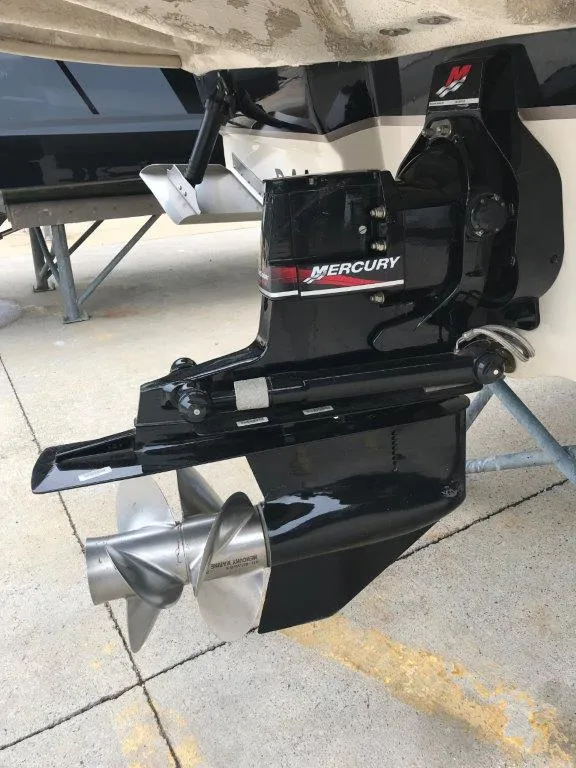 Slide: The Image of Mercury outboard motor on 2003 Sea Ray 240 Sundeck, featuring stainless steel propeller. - 17