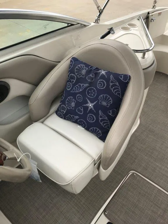 Slide: The Image of 2003 Sea Ray 240 Sundeck boat seat with nautical-themed cushion. - 5