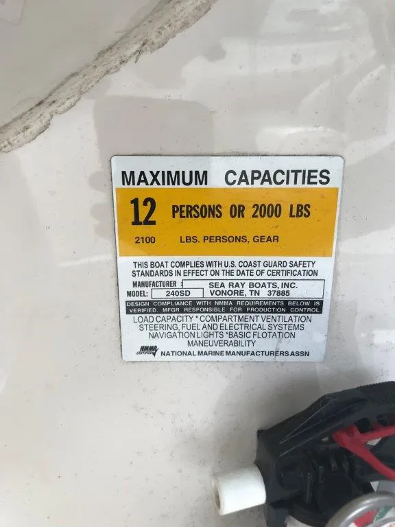 Slide: The Image of 2003 Sea Ray 240 Sundeck capacity label, 12 persons or 2000 lbs maximum. - 7