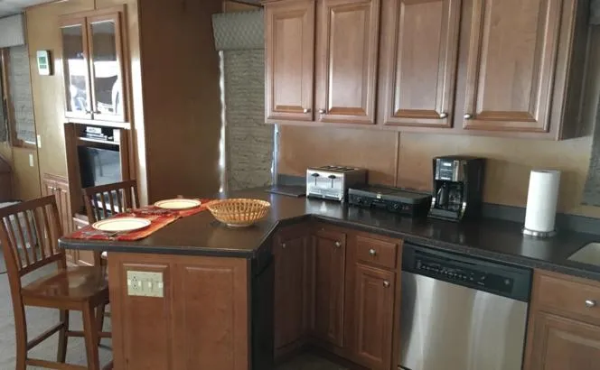 Slide: The Image of 2004 Sumerset Kapalua Share #13 kitchen with wooden cabinets and modern appliances. - 11