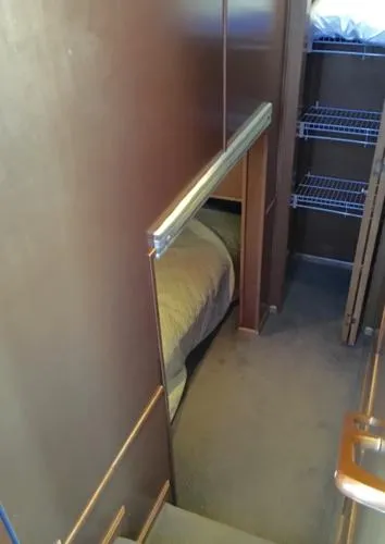 Slide: The Image of 2004 Sumerset Kapalua Share #13 interior cabin with bed and storage shelves. - 5