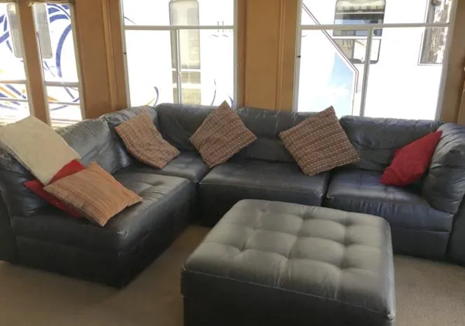 Slide: The Image of 2004 Sumerset Kapalua Share #13 houseboat interior with leather sectional sofa and ottoman. - 7