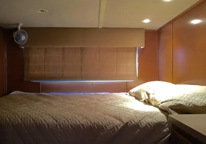 Slide: The Image of Interior bedroom of 2004 Sumerset Kapalua Share #13 houseboat with bed and window blinds. - 8