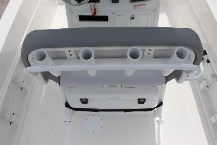 Slide: The Image of 2023 NauticStar 231 Hybrid boat interior with rod holders and storage. - 11