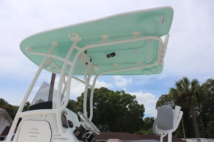 Slide: The Image of 2023 NauticStar 231 Hybrid boat with T-top and console. - 6