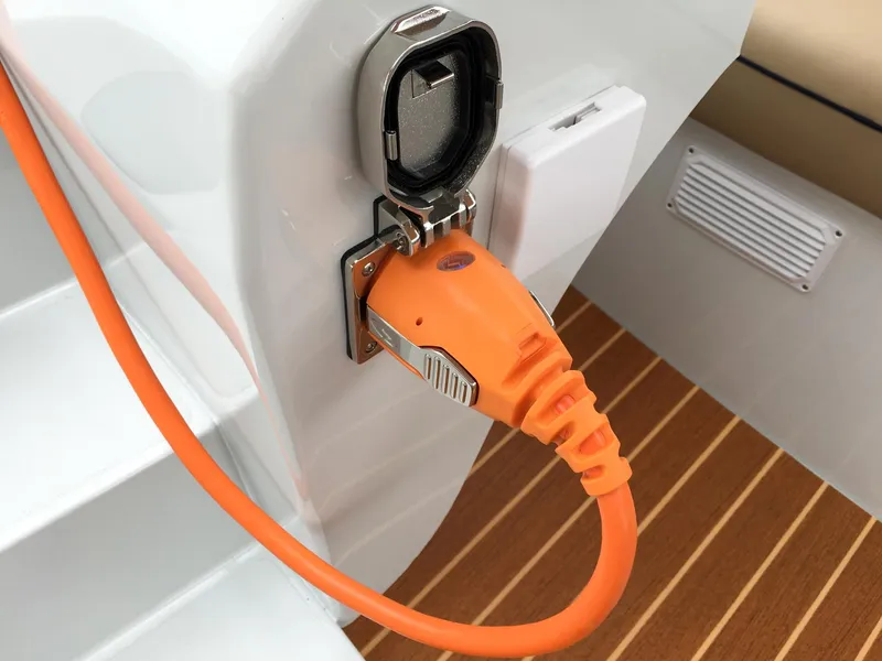 Slide: The Image of Orange charging cable connected to a 2026 Duffy Bay Island boat. - 10