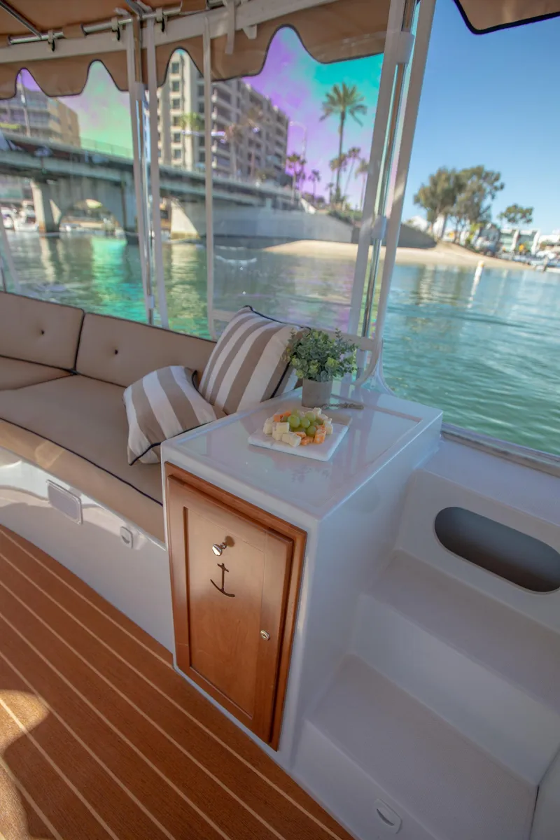 Slide: The Image of Luxurious 2026 Duffy Bay Island boat interior with waterfront view and elegant seating. - 8