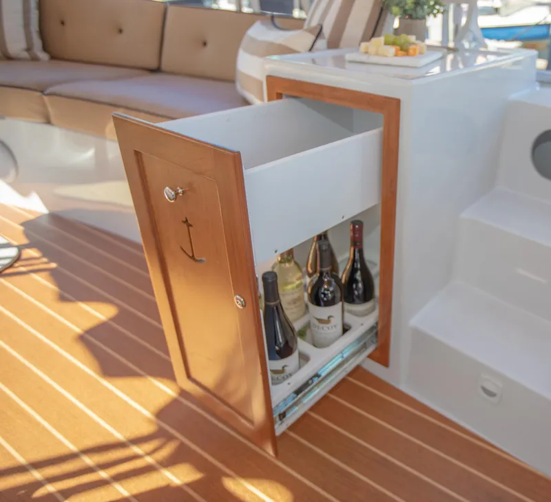 Slide: The Image of Luxury yacht interior with wine storage drawer on 2026 Duffy Bay Island model. - 9