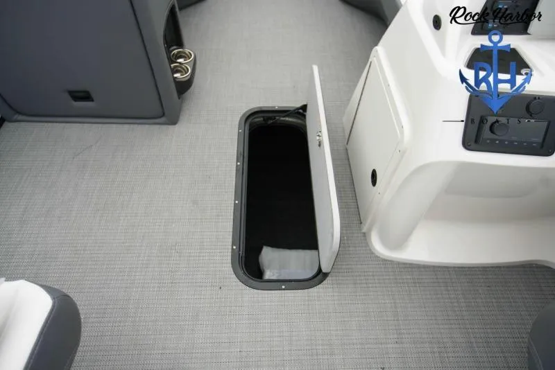 Slide: The Image of 2022 Manitou RF 23 Aurora LE VP II boat interior with open storage compartment. - 6