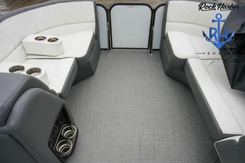 Slide: The Image of 2022 Manitou RF 23 Aurora LE VP II boat interior with white and gray seating. - 8