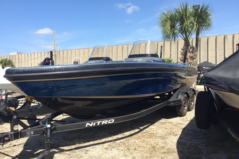 The Image of 2020 Nitro ZV21 boat on trailer, parked outdoors. - 1
