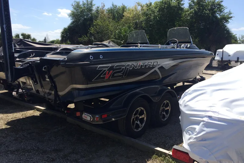 Slide: The Image of 2020 Nitro ZV21 boat on trailer, parked outdoors. - 3