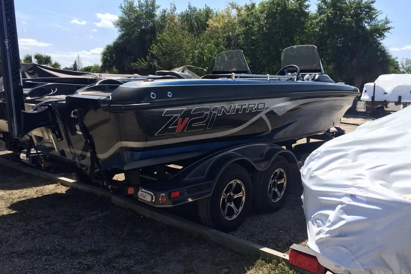 Slide: The Image of 2020 Nitro ZV21 boat on a trailer in an outdoor setting. - 5