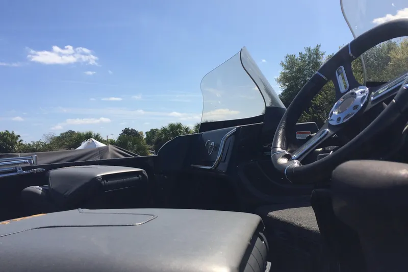 Slide: The Image of Interior of a 2020 Nitro ZV21 boat with steering wheel and windshield. - 8