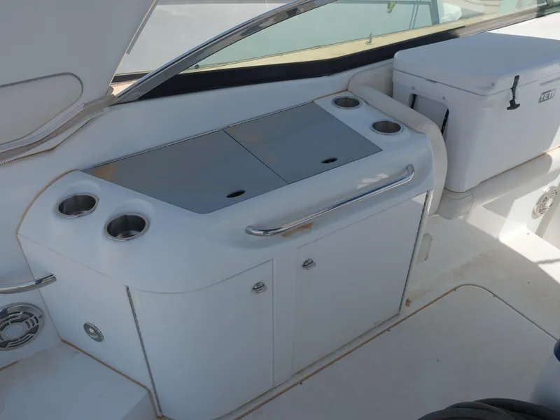 Slide: The Image of 2012 Formula 310 Sun Sport boat interior with kitchenette and storage. - 10