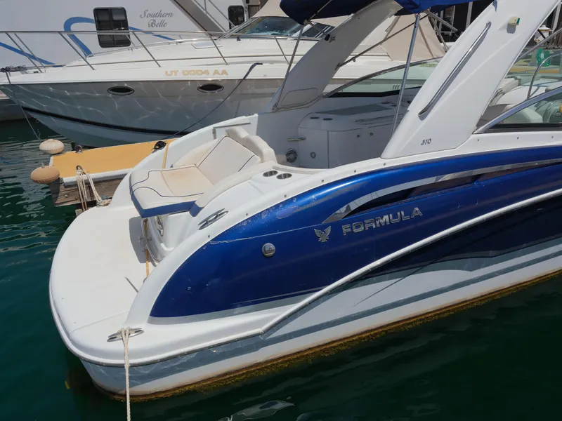 Slide: The Image of 2012 Formula 310 Sun Sport boat docked in marina. - 18