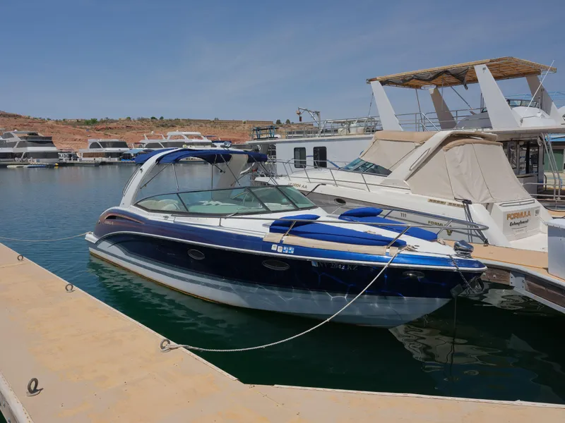 Slide: The Image of 2012 Formula 310 Sun Sport boat docked at a marina on a sunny day. - 19