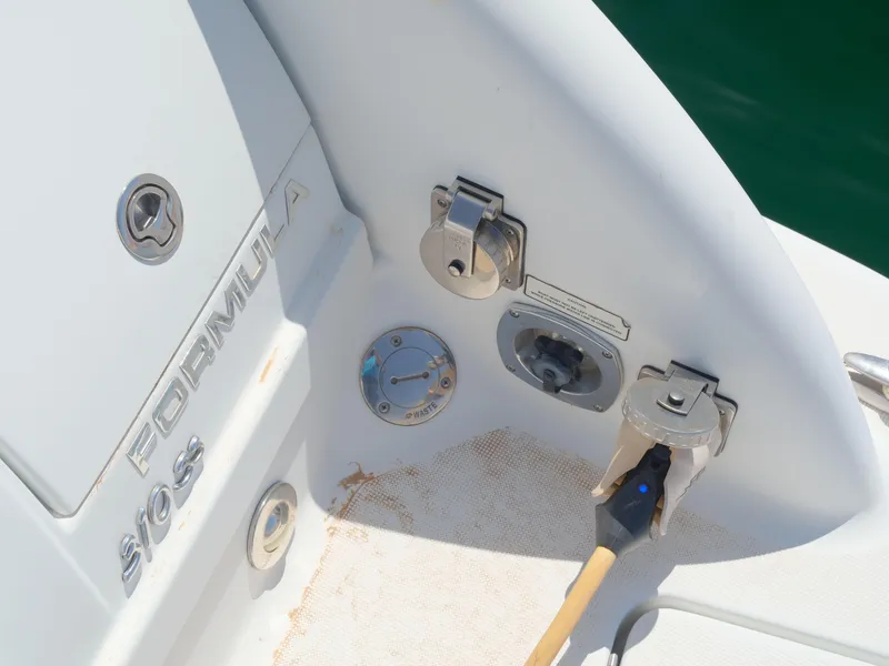 Slide: The Image of 2012 Formula 310 Sun Sport boat deck with fuel and water inlets. - 22