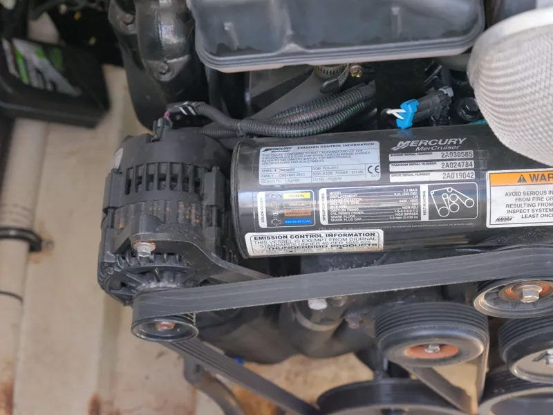 Slide: The Image of Close-up of a 2012 Formula 310 Sun Sport Mercury engine component. - 28