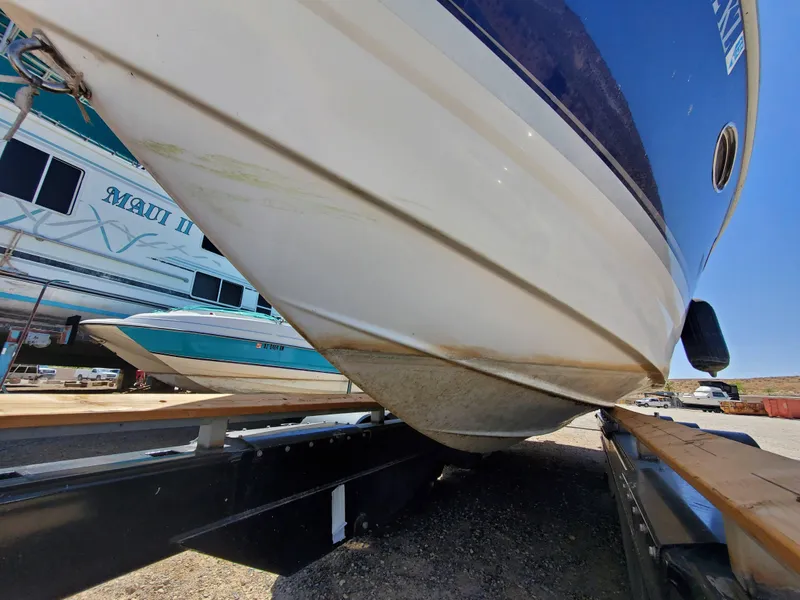 Slide: The Image of 2012 Formula 310 Sun Sport boat on a trailer, side view. - 32