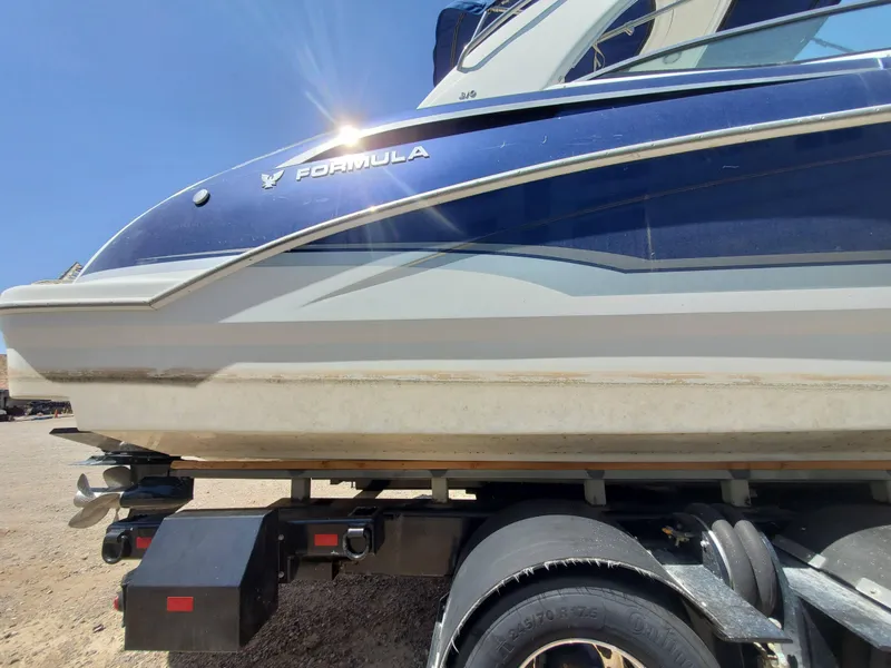 Slide: The Image of 2012 Formula 310 Sun Sport boat on a trailer, side view. - 36