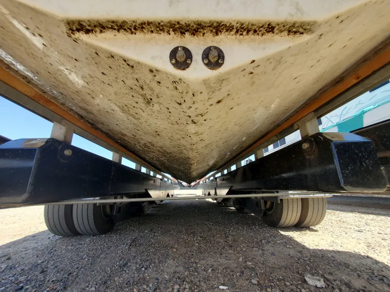 Slide: The Image of Underside view of a 2012 Formula 310 Sun Sport boat on a trailer. - 40