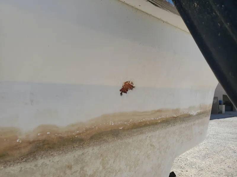 Slide: The Image of 2012 Formula 310 Sun Sport boat with hull damage and discoloration. - 43