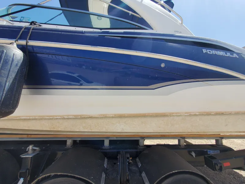 Slide: The Image of 2012 Formula 310 Sun Sport boat on a trailer, side view. - 44