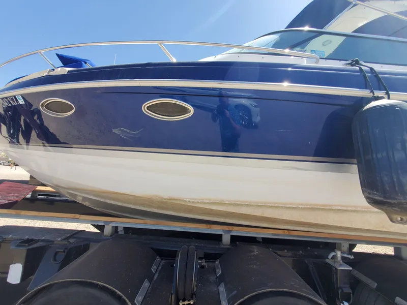 Slide: The Image of 2012 Formula 310 Sun Sport boat on a trailer, side view. - 45