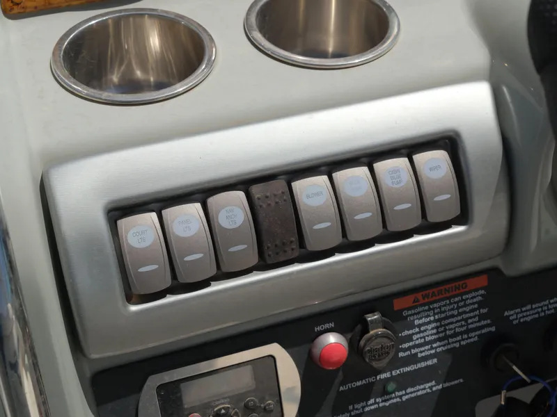 Slide: The Image of Control panel of a 2012 Formula 310 Sun Sport boat with cup holders. - 7