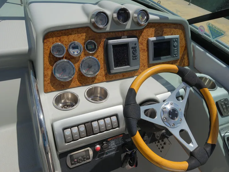 Slide: The Image of 2012 Formula 310 Sun Sport dashboard with gauges, controls, and steering wheel. - 8
