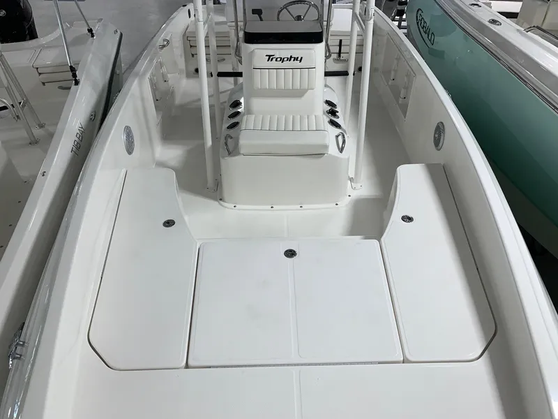 Slide: The Image of 2024 Bayliner T21 Bay boat interior with white seating and console. - 15