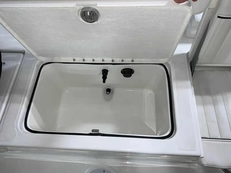 Slide: The Image of 2024 Bayliner T21 Bay boat storage compartment with open lid. - 6