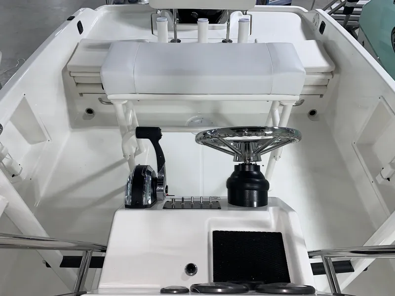Slide: The Image of 2024 Bayliner T21 Bay boat interior with steering wheel and seating. - 11