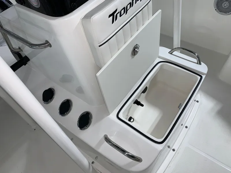 Slide: The Image of 2024 Bayliner T21 Bay boat console with storage compartment open. - 12