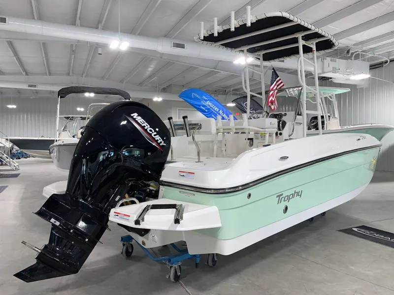 Slide: The Image of 2024 Bayliner T21 Bay boat with Mercury outboard motor in showroom. - 3