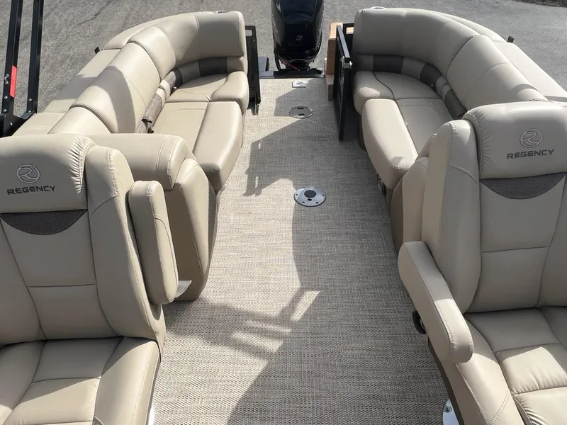 Slide: The Image of 2022 Regency 250 LE3 boat interior with beige leather seating. - 2