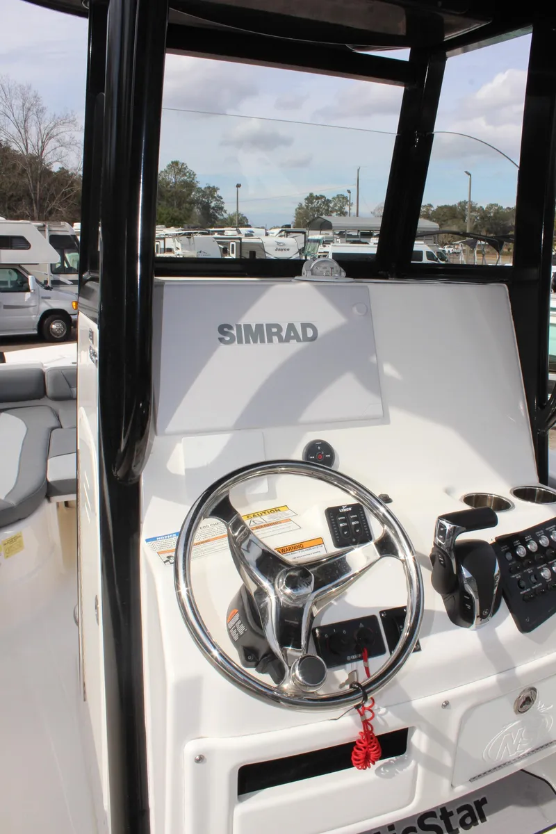 Slide: The Image of 2023 NauticStar 251 Hybrid boat console with Simrad navigation system. - 10