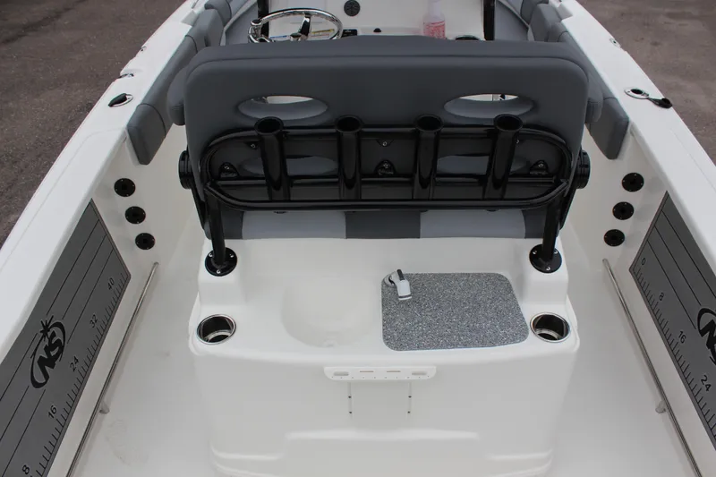 Slide: The Image of 2023 NauticStar 251 Hybrid boat interior with seating and storage compartments. - 13