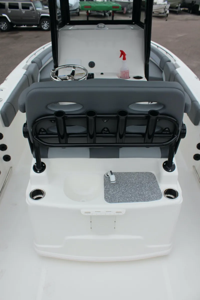 Slide: The Image of 2023 NauticStar 251 Hybrid boat interior with seating and console. - 23