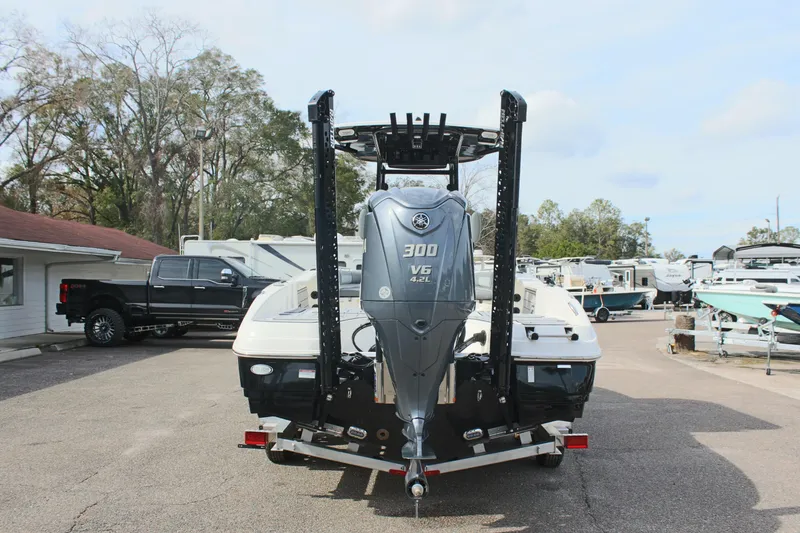 Slide: The Image of 2023 NauticStar 251 Hybrid boat with Yamaha 300 V6 engine, parked outdoors. - 5
