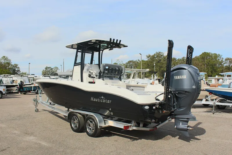 Slide: The Image of 2023 NauticStar 251 Hybrid boat with Yamaha engine on trailer. - 6