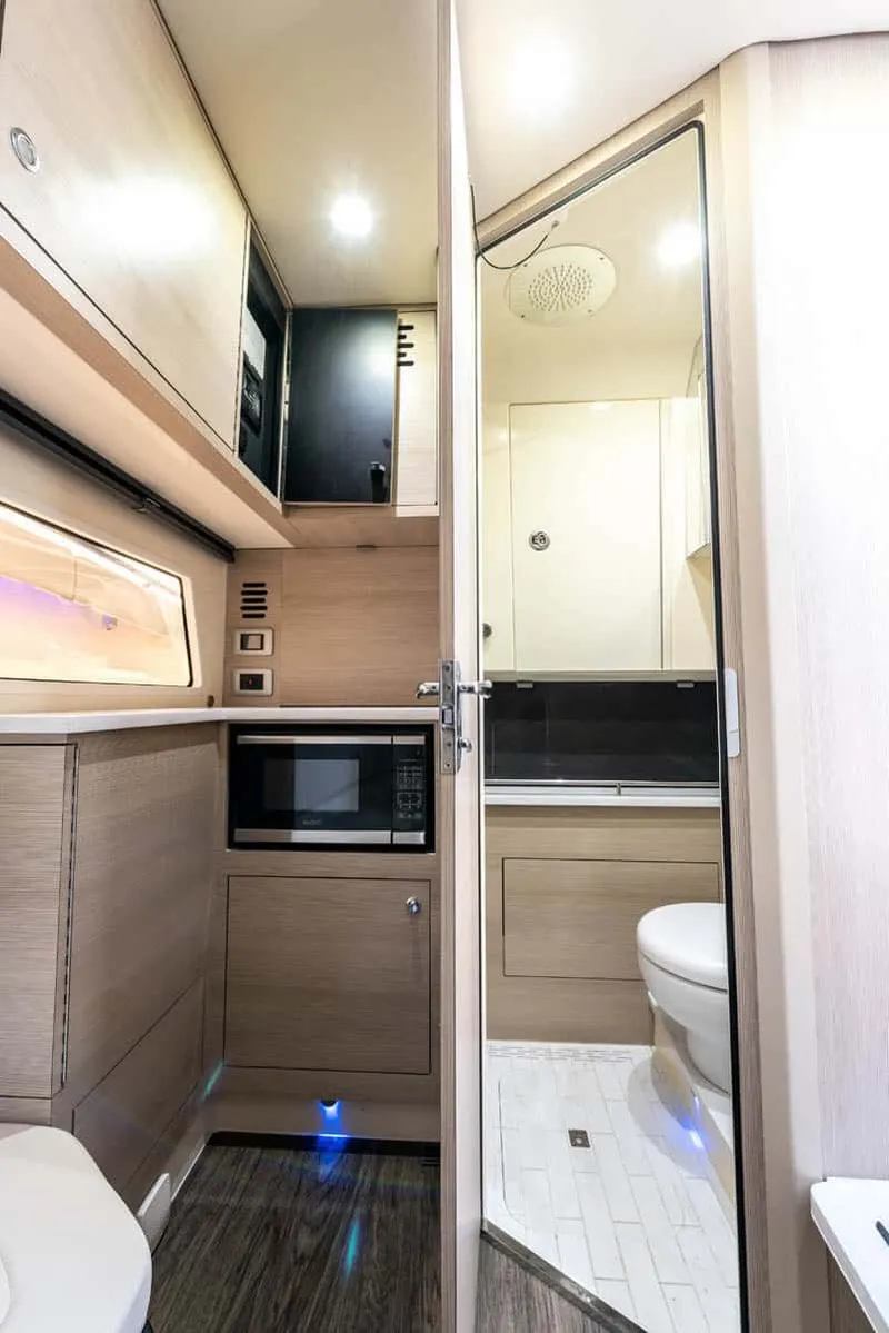 Slide: The Image of Interior of 2026 Scout 377 LXF featuring kitchen and bathroom. - 12