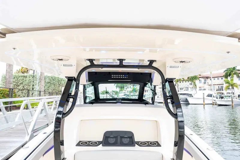 Slide: The Image of Interior view of 2026 Scout 377 LXF boat at the marina. - 13