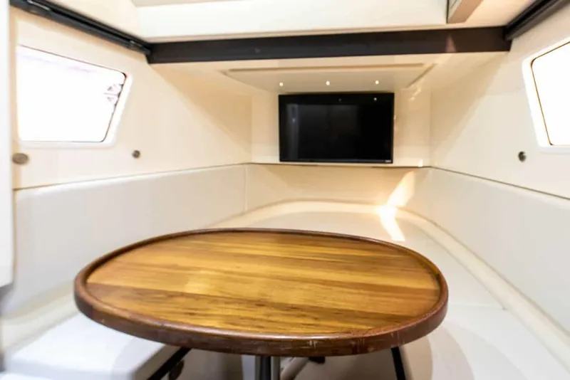 Slide: The Image of Interior of 2026 Scout 377 LXF with wooden table and TV. - 18
