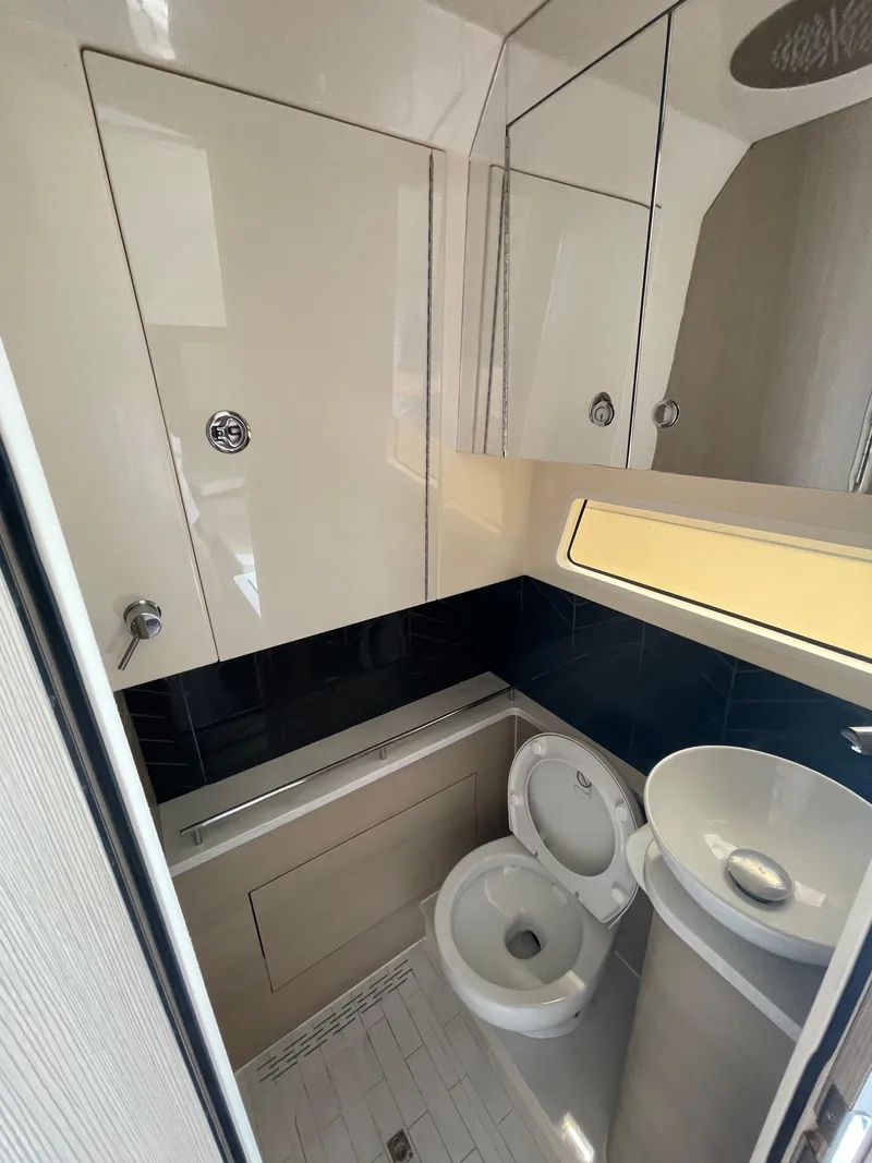 Slide: The Image of 2025 Scout 377 LXF boat bathroom with modern fixtures and sleek design. - 5