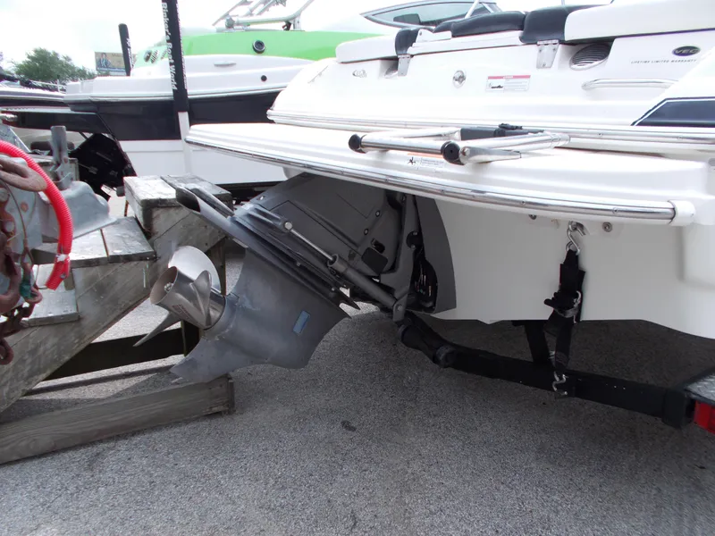 Slide: The Image of 2008 Glastron GT 205 boat stern and outboard motor on trailer. - 10