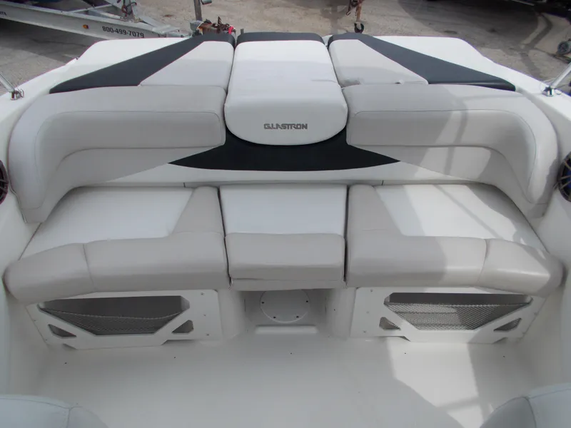 Slide: The Image of 2008 Glastron GT 205 boat interior seating with white and black upholstery. - 14