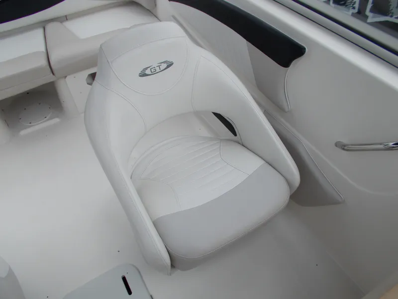 Slide: The Image of 2008 Glastron GT 205 boat interior with white captain's chair. - 16